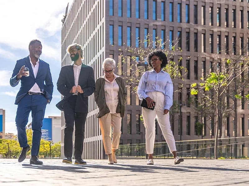 Public servants walking past civic office buildings